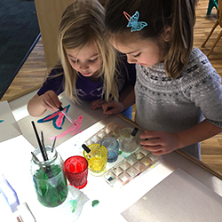 Preschool children working on arts and crafts activity together