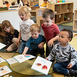 Group of kids on the floor with flashcards