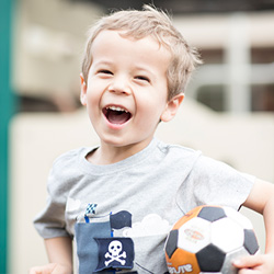 Smiling toddler enjoying outdoor playtime